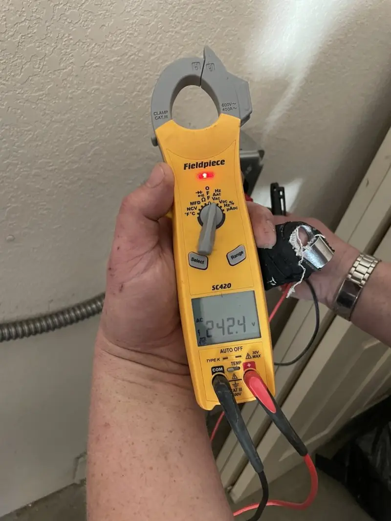 Voltage testing with clamp meter during Electrical Installation Services in St. Augustine Beach